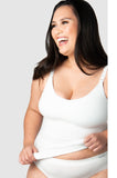 White maternity camisole by HOT MILK, featuring adjustable straps and soft fabric, available in sizes S and XL.