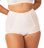 Triumph Belform Support Control Panty in skin nude, seamless undergarment with shaping fit, visible on model's lower torso.