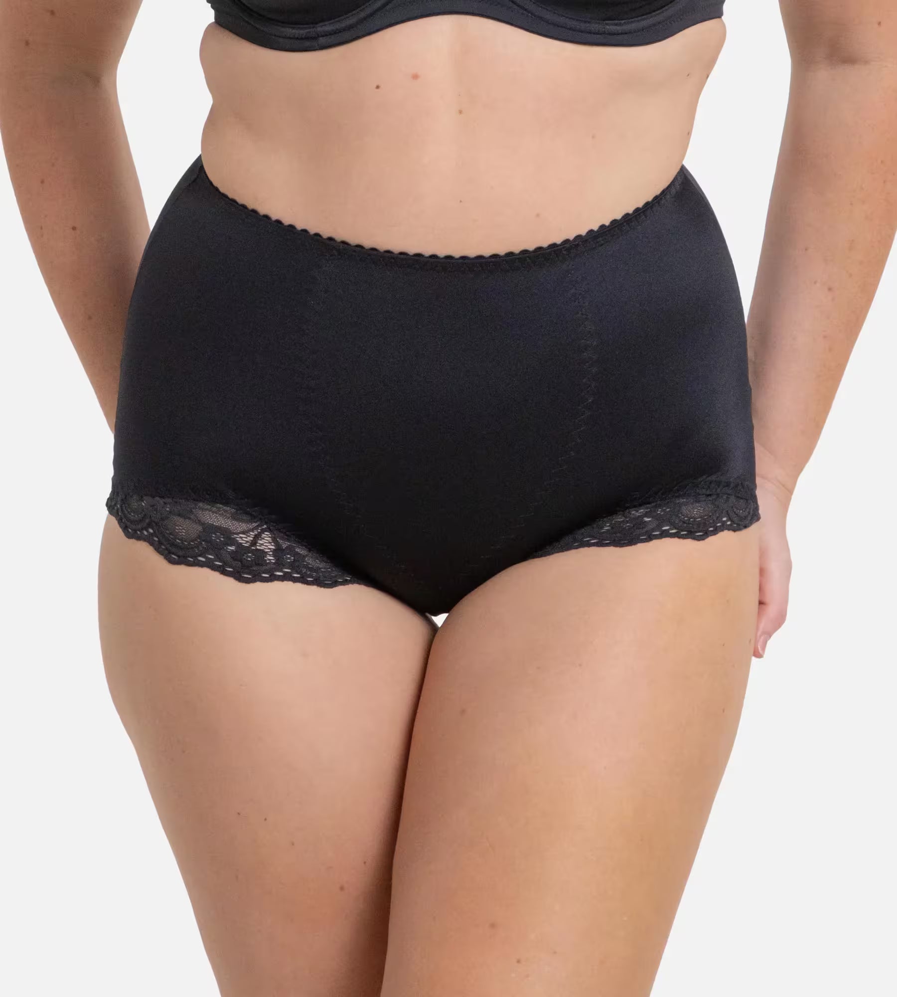 Triumph Tum-E-Lace shapewear pant with tummy control, seamless design, and lace details for a smooth and sculpted look.