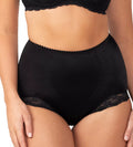 Triumph Tum-E-Lace shapewear pant with tummy control, black fabric, seamless design, and lace detailing for shaping and support.