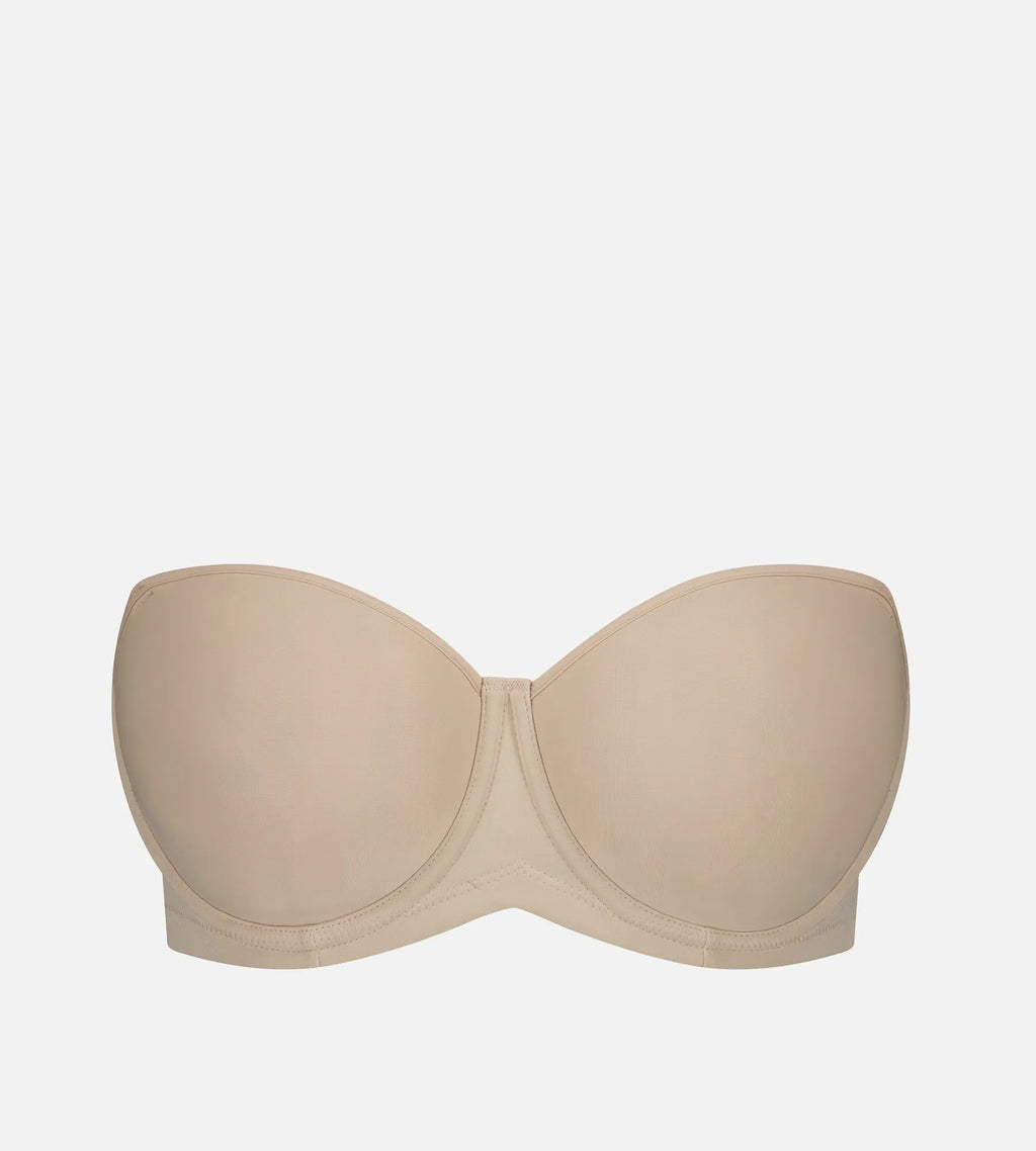 Nude Triumph silhouette strapless underwire bra with smooth cups and supportive design, ideal for strapless or special occasion wear.