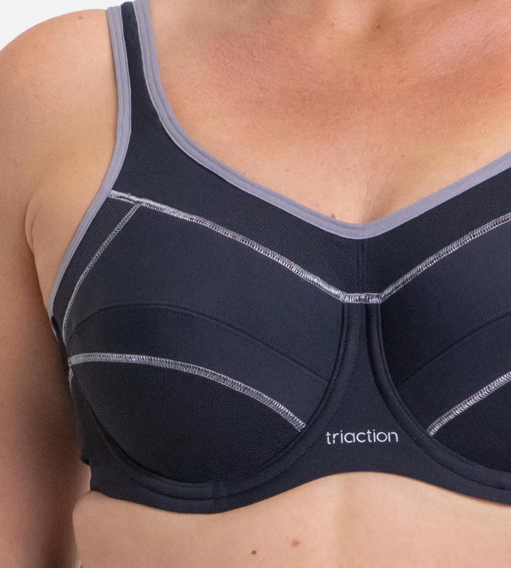 Triumph Triaction black underwire sports bra with supportive design and adjustable straps, ideal for active wear and workout comfort.