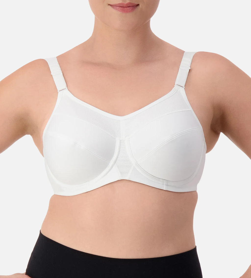 White Triaction wired sports bra by Triumph, featuring supportive design and adjustable straps for active wear.