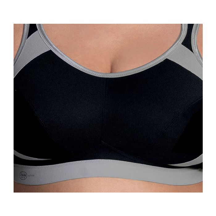 Black and grey ANITA EXTREME CONTROL sports bra offering maximum support, shown in close-up with adjustable straps and breathable fabric.