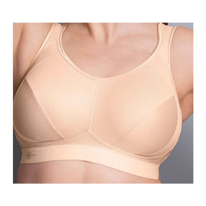ANITA Extreme Control sports bra in desert color, offering maximum support, shown on a model for active athletic wear.