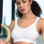 White ANITA Extreme Control Sports Bra with maximum support, featuring adjustable straps and breathable fabric for active wear.