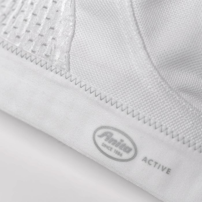 White ANITA Extreme Control Sports Bra designed for maximum support, showing its breathable fabric and secure fit.