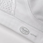 White ANITA Extreme Control Sports Bra designed for maximum support, showing its breathable fabric and secure fit.
