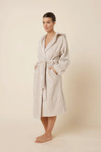 Ginger Lily Adriana Terry towel robe in biscuit color, soft sleepwear with a relaxed fit, shown from the side view.