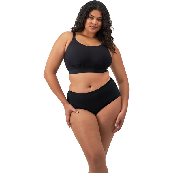 Black Downtime bralette by ELOMI, wireless bra with soft fabric and supportive fit, shown on a model.