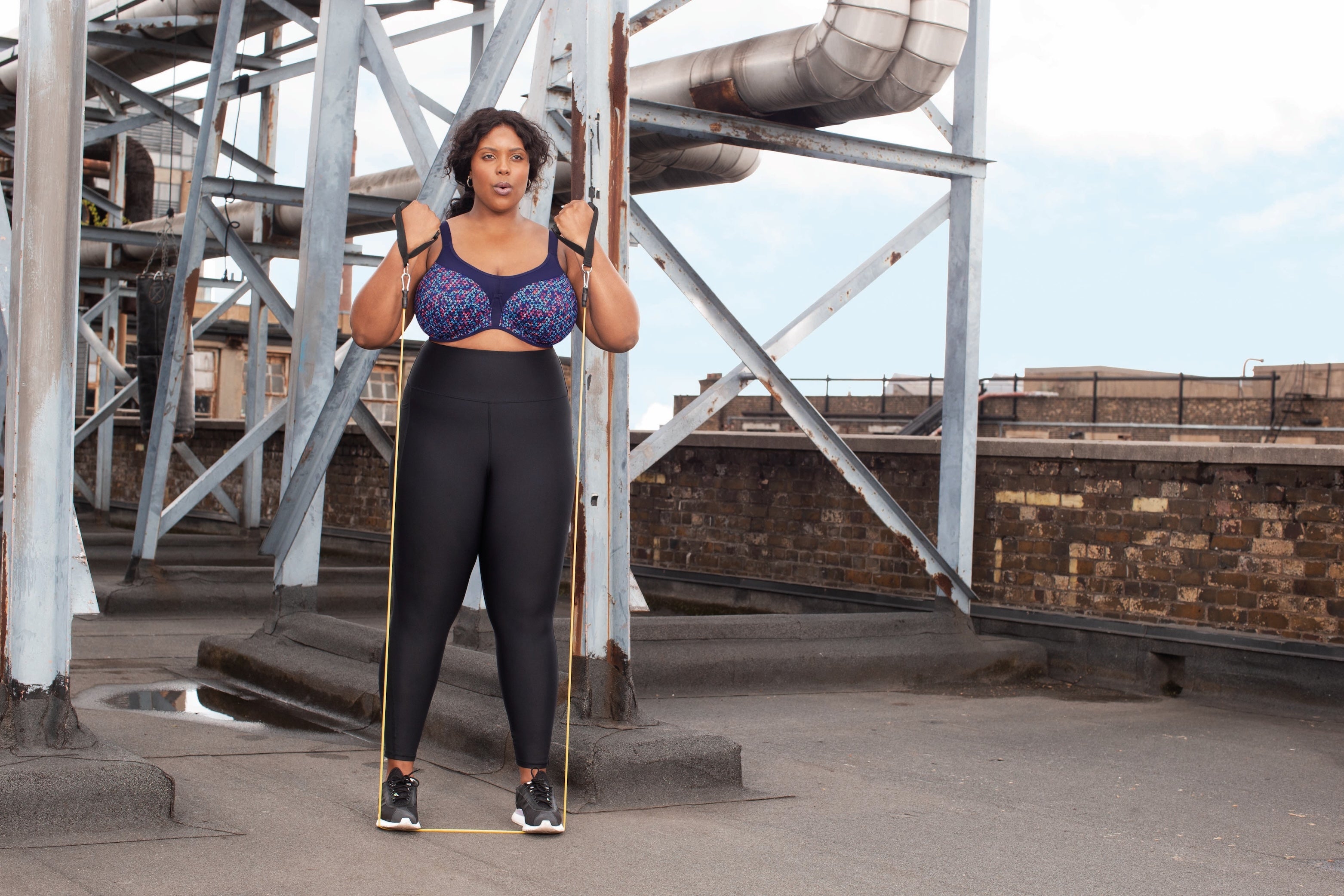 EloMi Energise underwired sports bra in navy with geometric print, designed for support and comfort during workouts.