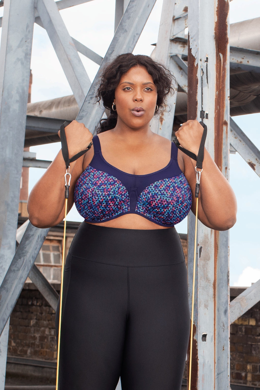 Navy Geo Print Energise underwired sports bra by ELOMI showing supportive design and stylish pattern on the fabric.