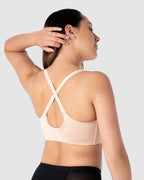 Hot Milk leakproof wirefree nursing bra in bamboo lace with a racerback design, in a soft frappe color.