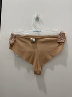Beige GISELE G-string underwear by CORIN, featuring minimal coverage and delicate fabric for a comfortable fit.