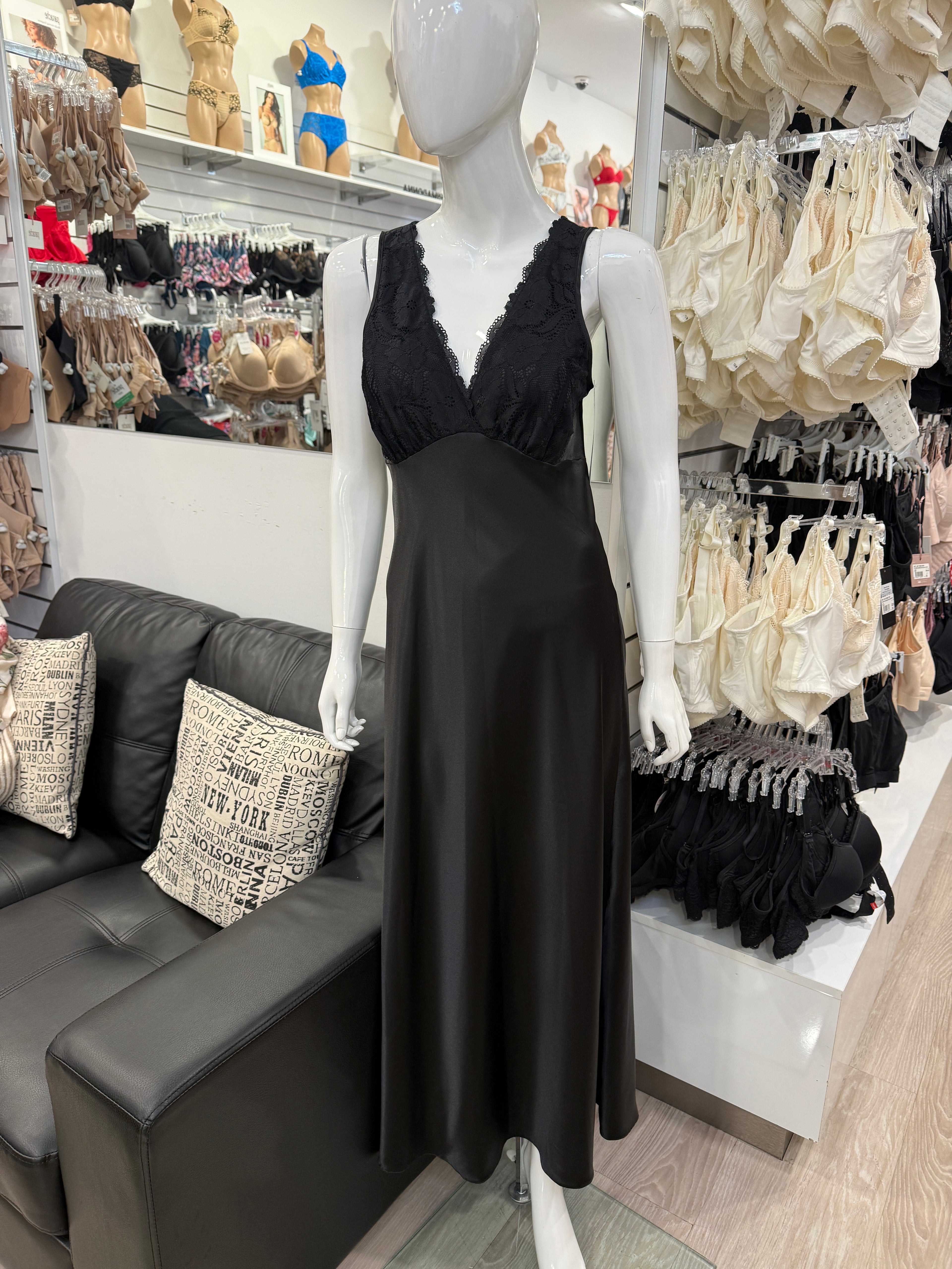Black satin Beck long nightie by Essence, elegant sleepwear with a smooth, shiny fabric, shown hanging or displayed flat.