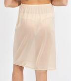 Skin-colored Matt Tricot half slip with lace trim, 50cm length, by Brandella, shown on a flat surface.