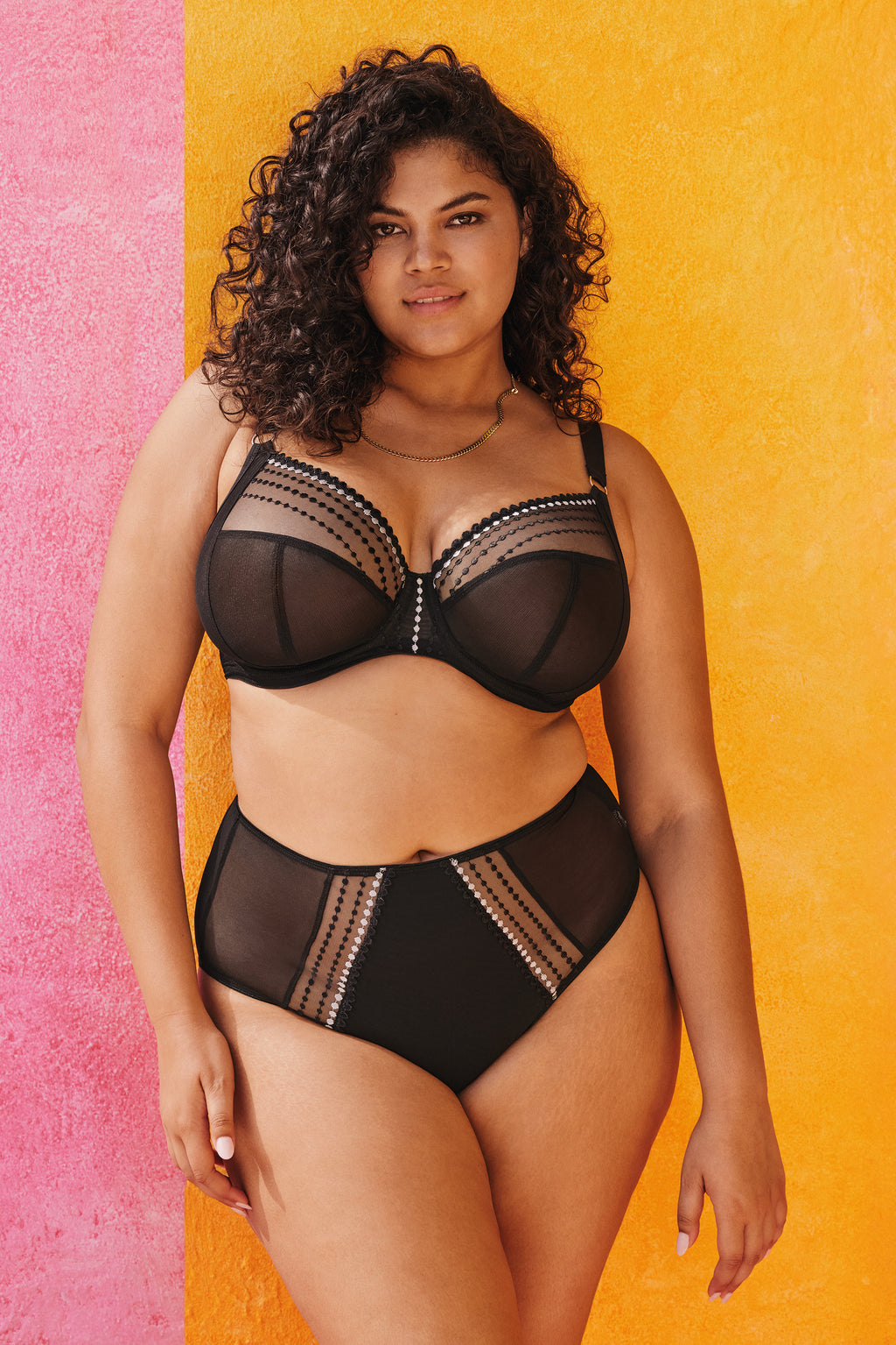 Black Elomi Matilda plunge side support bra with underwired cups and adjustable straps, shown on a mannequin.