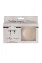 Secret Weapons headlight dimmers nipple covers for low-cut tops, nude color, packaged as discreet accessories for added coverage.