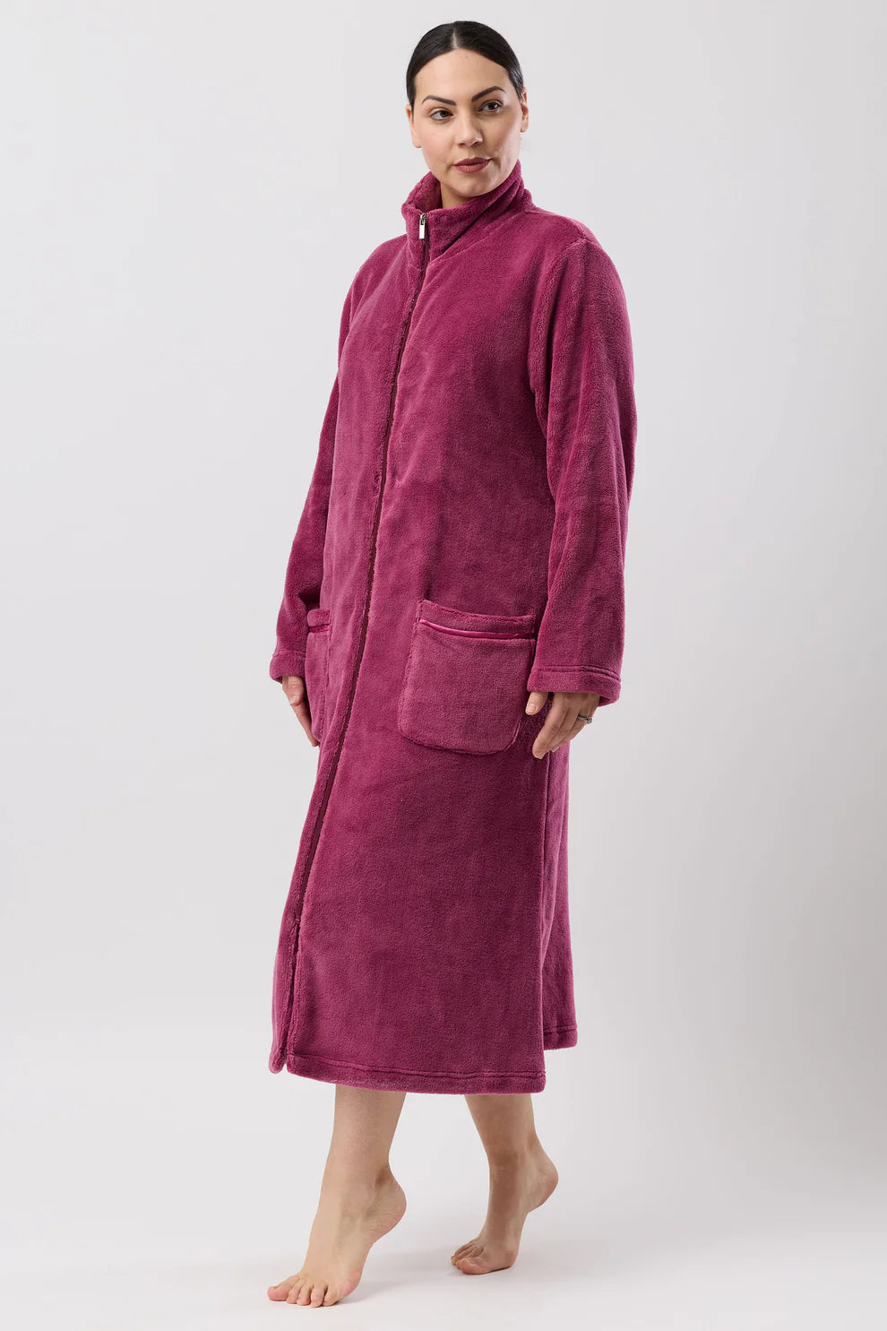 Schrank berry-colored fleece zip dressing gown, mid-length sleepwear with soft fabric and front zipper, displayed on a hanger.