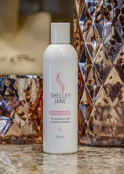 STARKLES synthetic hair wig conditioner applied to a Shelley-Jasne wig, showing smooth, shiny synthetic hair.