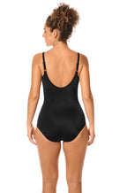 Black and white polka dot mastectomy swimsuit by Amoena with adjustable straps, available in sizes 10, 12, and 14.