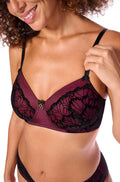 Black and pink wirefree bra by Amoena, size 22AA, featuring soft cups and adjustable straps.