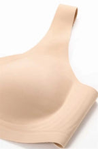 Nude Linda Bra crop top by AMOENA in size L, featuring soft fabric and seamless design, displayed on a plain background.