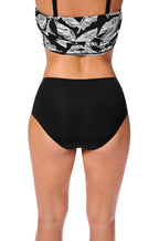 Black and white Lanzarote swim briefs for mastectomy, available in sizes 14 and 20, by AMOENA.