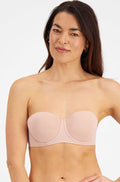 Nude Berlei luminous strapless bra in size 10, featuring a smooth design and adjustable back for comfort.