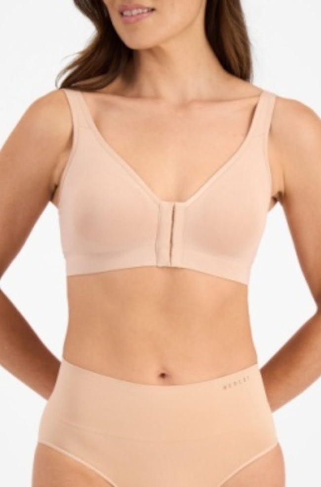 Nude bamboo crop top post-surgery recovery bra in size L by Berlei, compatible with breast prosthesis.