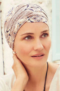 Beige yoga hat by Christine Headwear with elegant ornaments, made for comfortable, stylish wear during yoga practice.