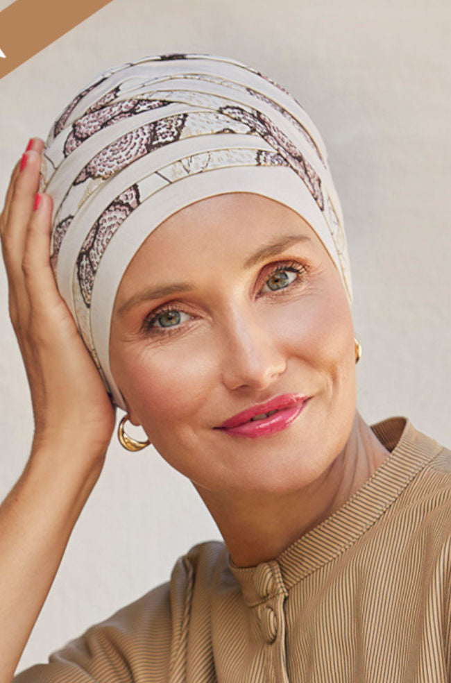Pink Shanti Turban hat by Christine Headwear featuring a vibrant blooming pink design and comfortable, stylish fit.