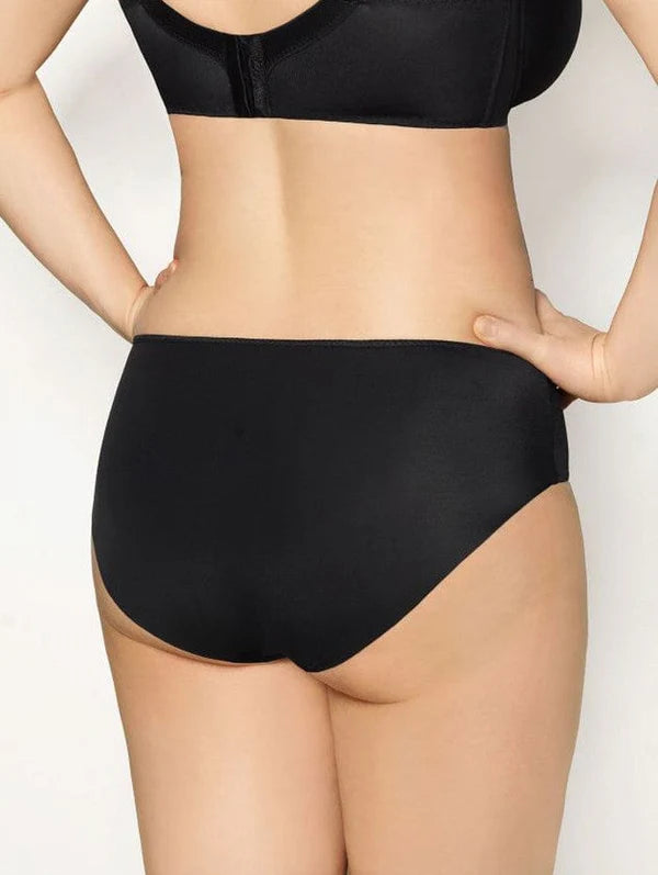 Black Corin Virginia Free Cut Deep Brief underwear shown on a model, featuring a sleek, comfortable design and smooth fabric.