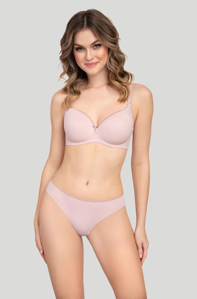 Blush pink Virginia laser cut brief by Corin, showcasing intricate laser-cut detailing and a smooth fabric finish.