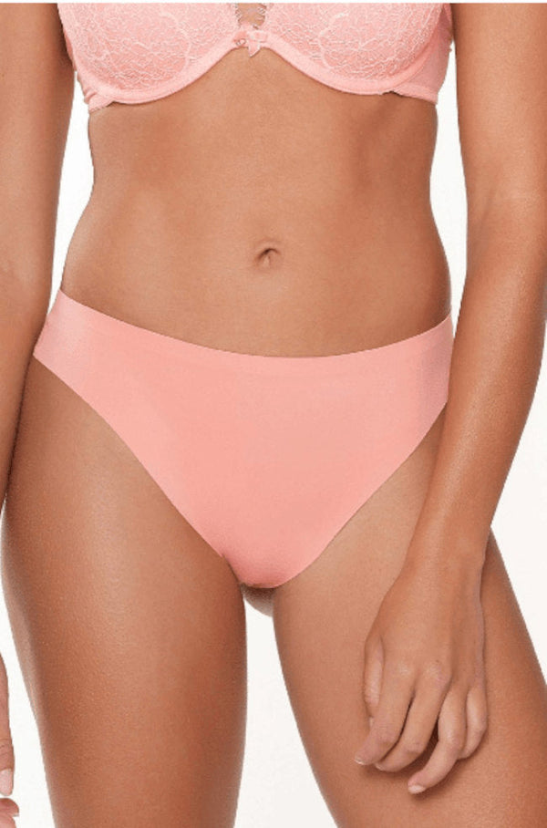 Lingadore seamless coral G-string underwear, comfortable daily thong with no panty line, designed for a smooth fit and all-day wear.