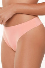 Seamless coral G-string thong by LINGADORE, featuring no panty line design for all-day comfort.