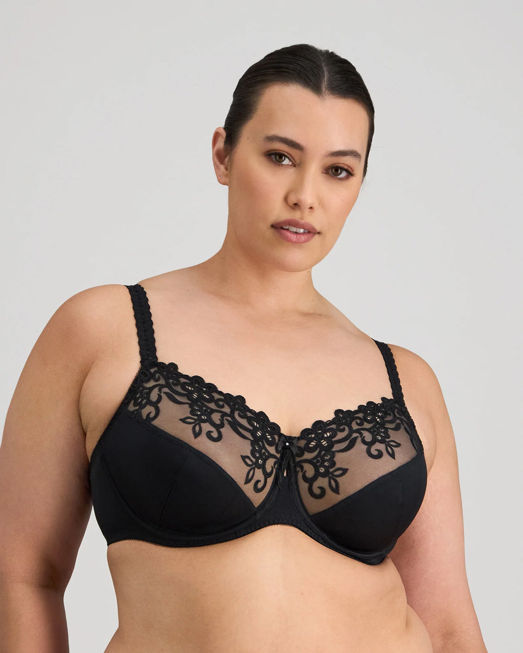 Black Coral Underwire Bra by FAYREFORM with underwire support and adjustable straps, featuring a smooth fabric finish.