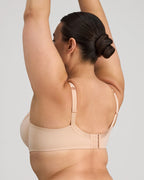 Coral underwire bra by FAYREFORM featuring floral lace embroidery and supportive design.