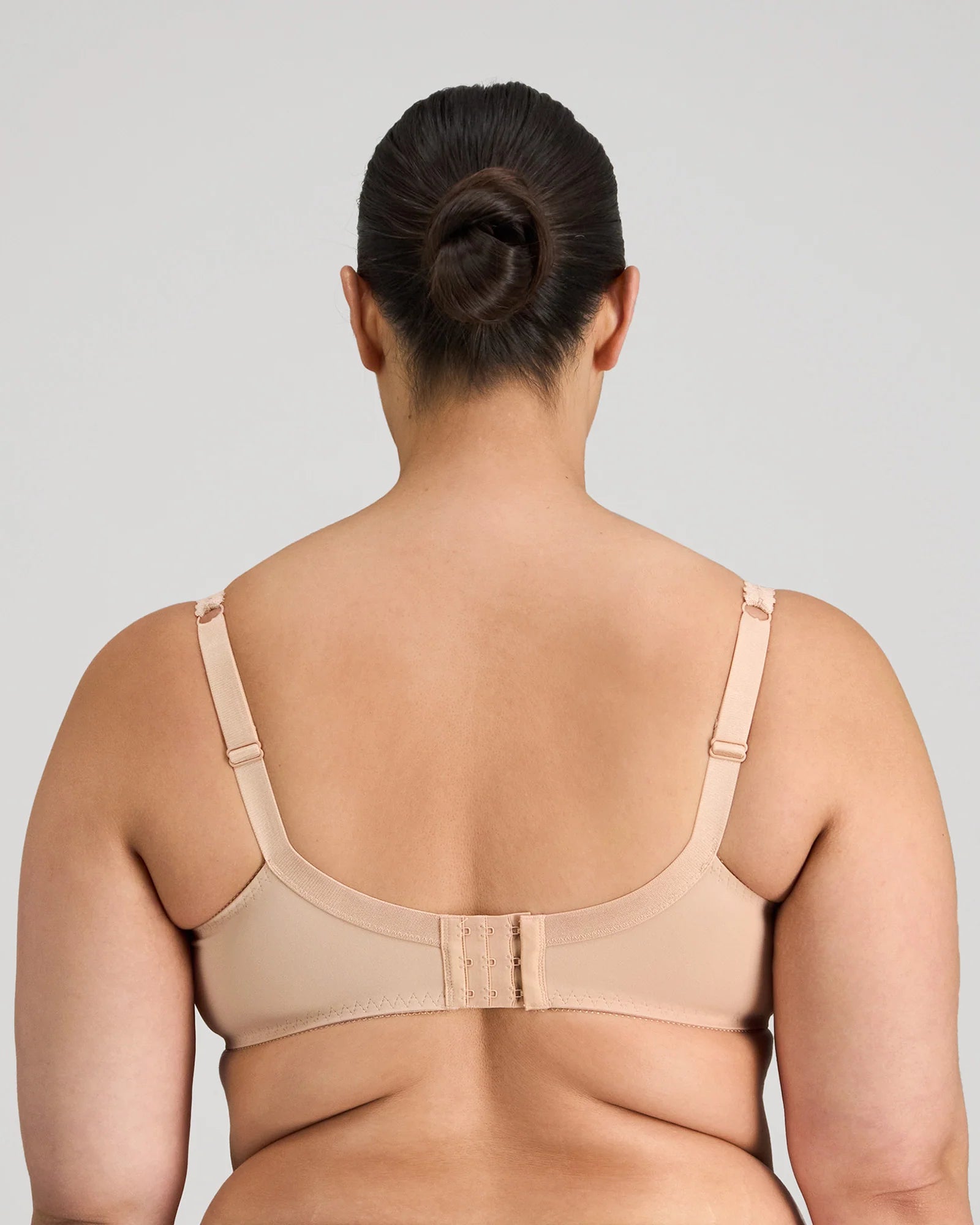 Fayreform Coral Underwire Bra in Latte with floral lace embroidery, showcasing the detailed lace design and supportive underwire.