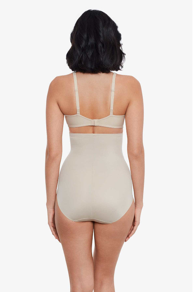 Nude high waist shapewear brief from Miraclesuit, designed for a smooth silhouette and comfortable fit.