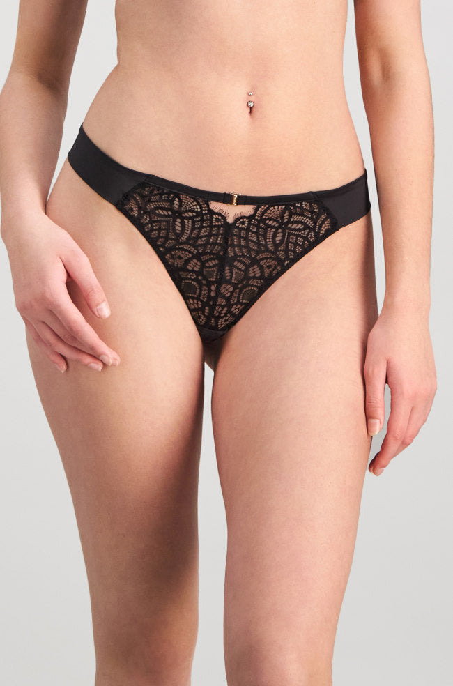 Black lace Grand Finale thong by Pleasure State, featuring intricate detailing and a sleek design.