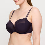 Primadonna Twist East End full cup bra in charcoal, featuring supportive design and smooth fabric, shown on a mannequin.