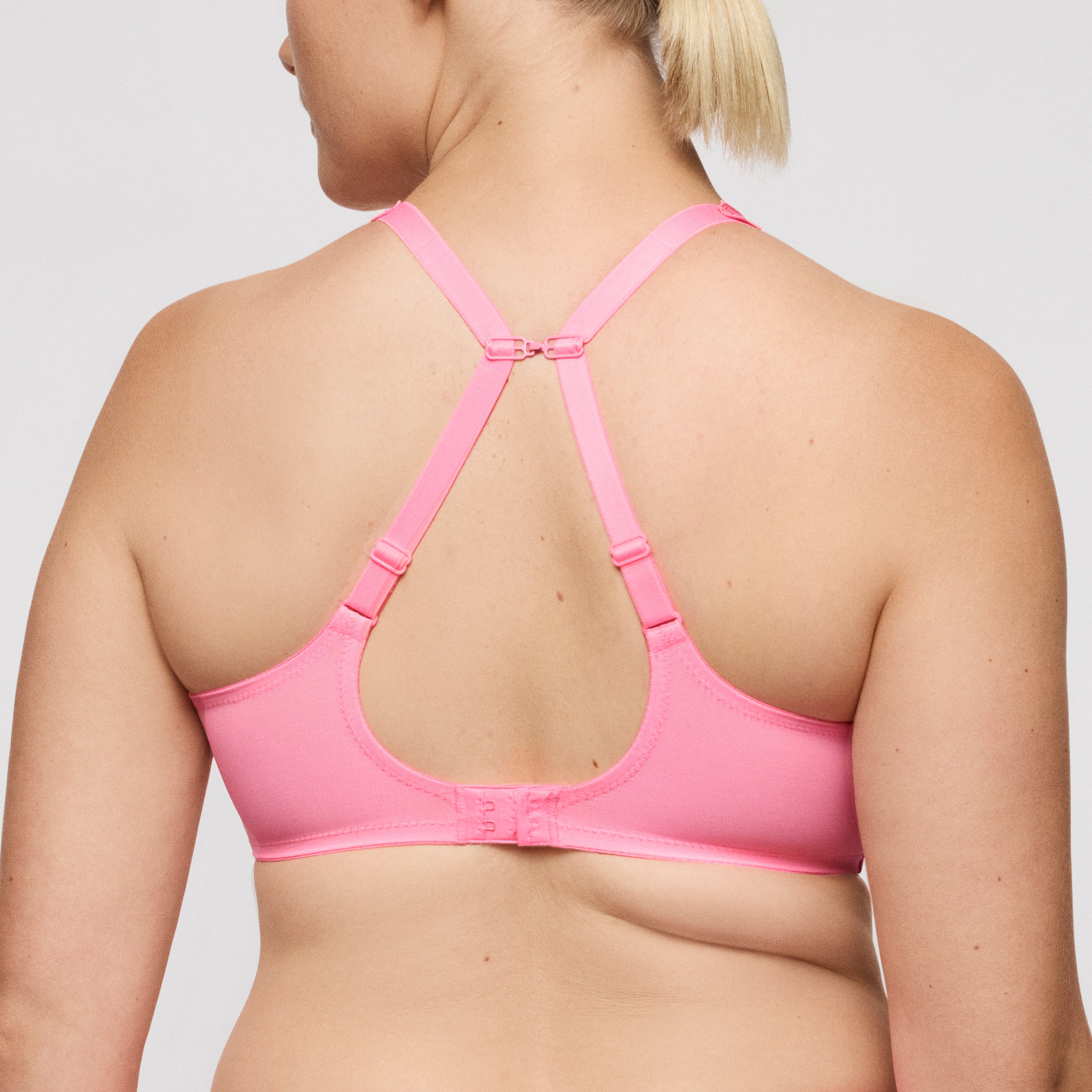 Primadonna Twist Twixie full cup bra in happy pink with lace detailing, underwire support, and adjustable straps.
