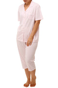 Pink polka dot pajama set by SHRANK with button-front top, breast pocket, and contrasting piping detail.