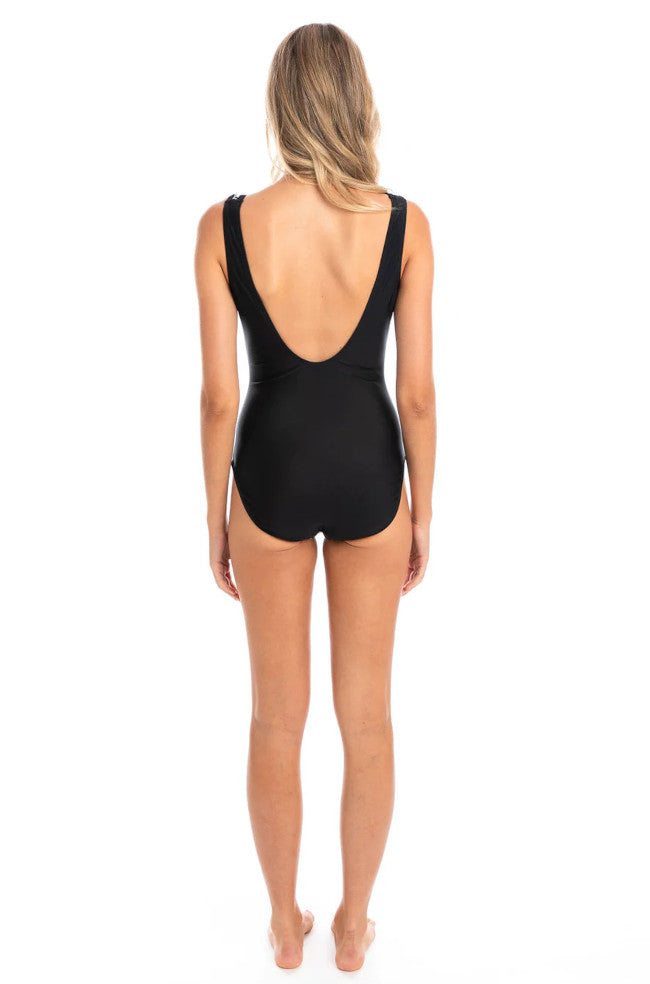 Black and white V-neck zip one-piece swimsuit by TOGS featuring tummy control, perfect for stylish swimming and beachwear.