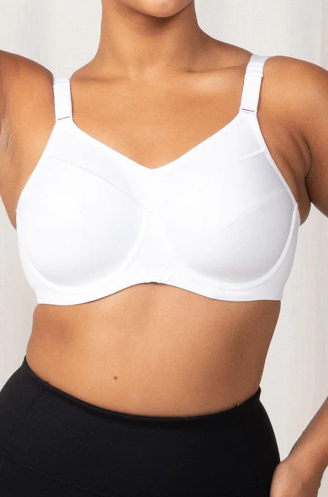White Triaction sports bra by Triumph in size 10, featuring supportive straps and breathable fabric.