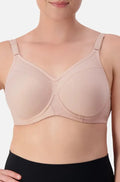 Nude Triaction Sport Bra by Triumph, size 10DD, featuring contouring design and adjustable straps