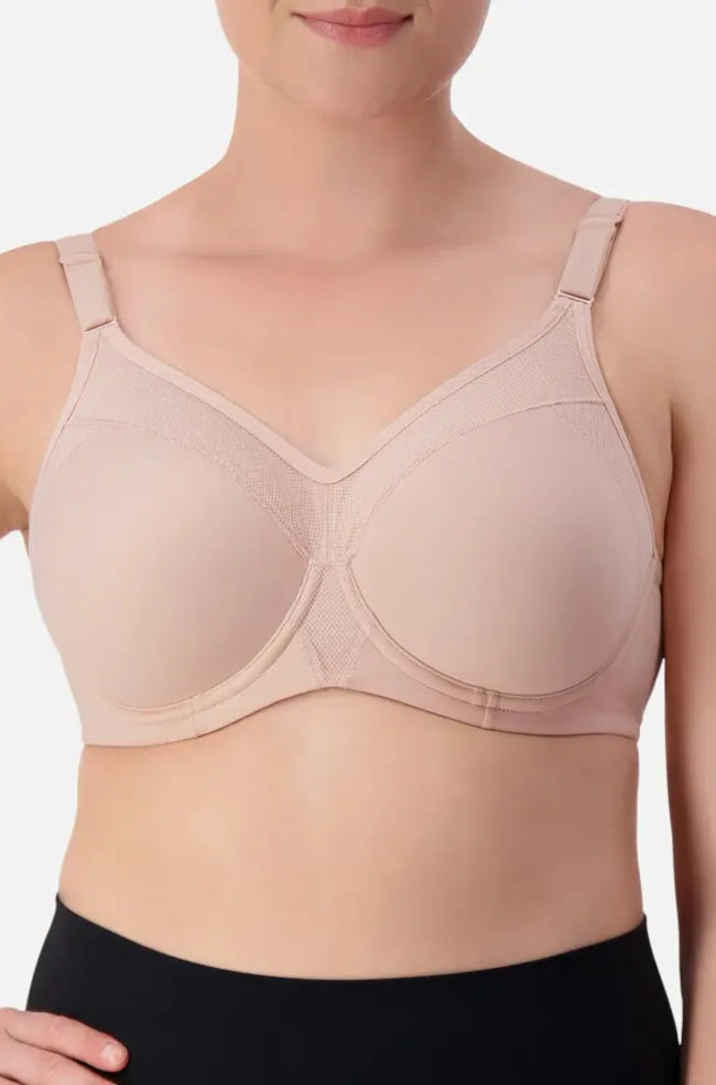 Nude Triaction Sport Bra by Triumph, size 10DD, featuring contouring design and adjustable straps