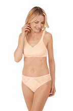 Peach floral lace wirefree mastectomy bra by Amoena, featuring adjustable straps and bilateral pockets.