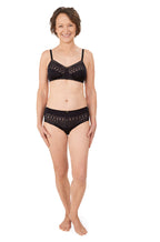 Black and sand wirefree bra by Amoena, designed for comfortable fit and breast care.